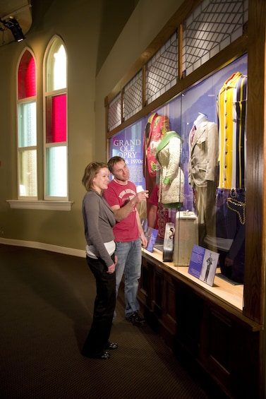 Show item 5 of 6. Costumes on display at the Ryman Auditorium in Nashville
