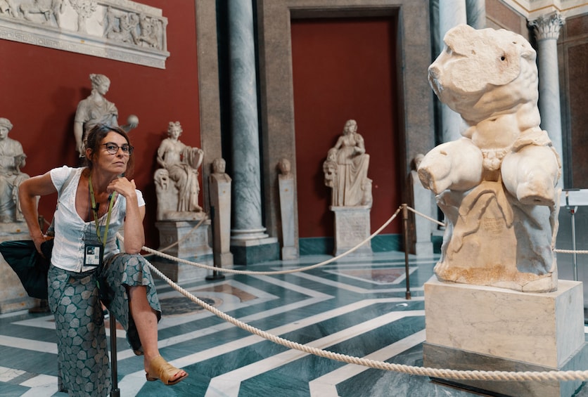 Woman visiting the Vatican Sistine Chapel