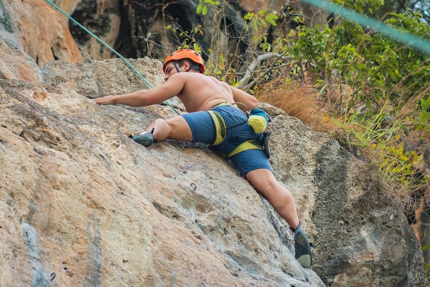 Man focused on the Rock Climbing Course at Railay Beach