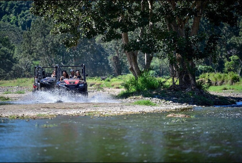 Tourists driving ATV enter water in Punta Cana