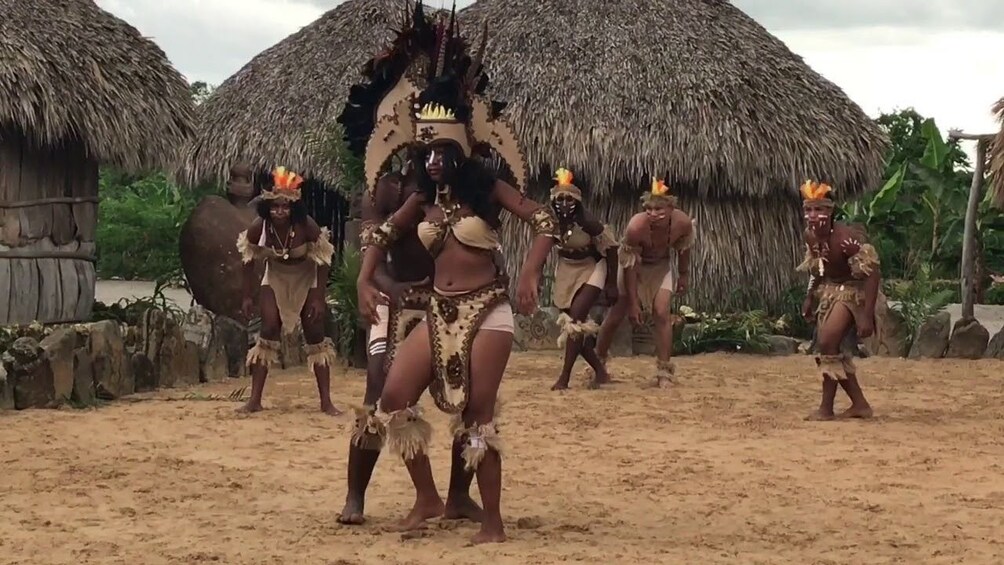 Men and women in traditional dress gather to perform Taino Show