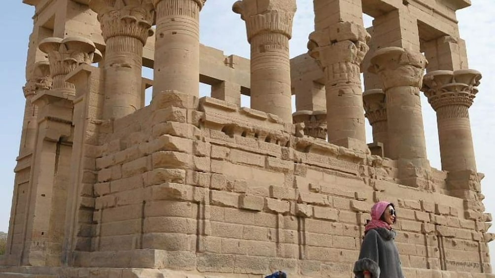 Woman standing in front of the Trajan's Kiosk in Egypt 