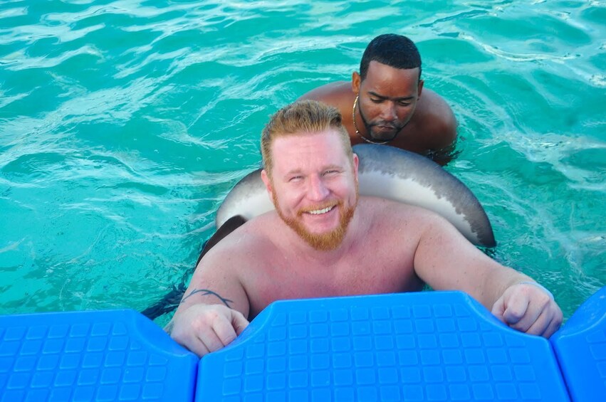 Guests swim and interact with marine animals in Punta Cana