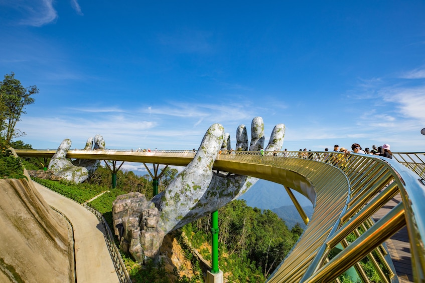 Panoramic view of the Golden Bridge, lifted by two giant hands in the Bà Nà Hills resort, near Da Nang, Vietnam