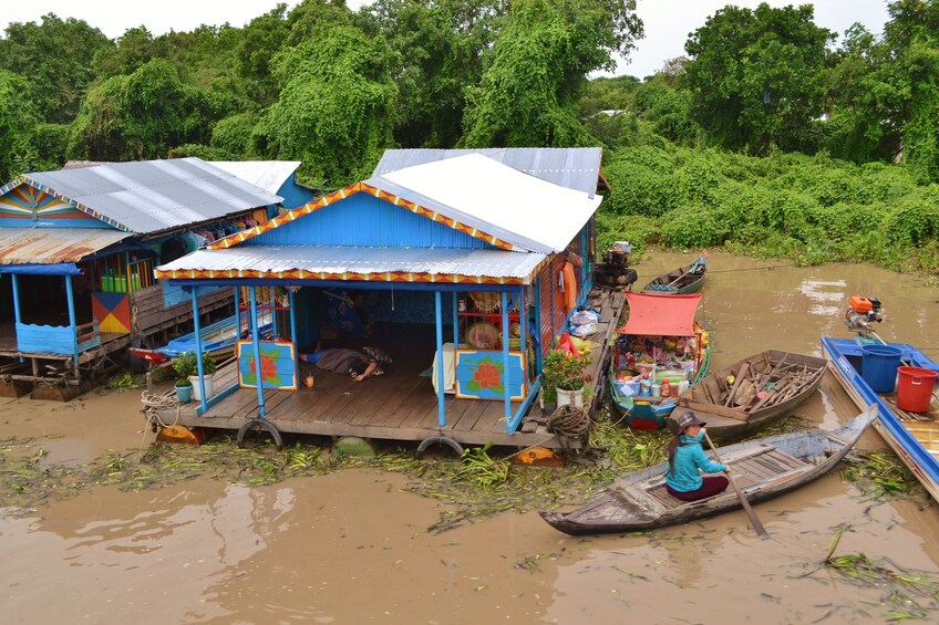 Boats and building in the muddy waters of Tonle Sap Lake