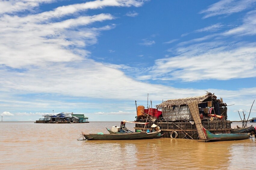 Building and boat on Tonle Sap Lake on a sunny day