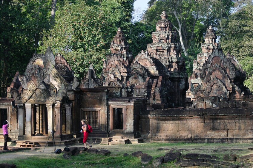 Tourists explore the shrines of Banteay Srei in Angkor, Cambodia