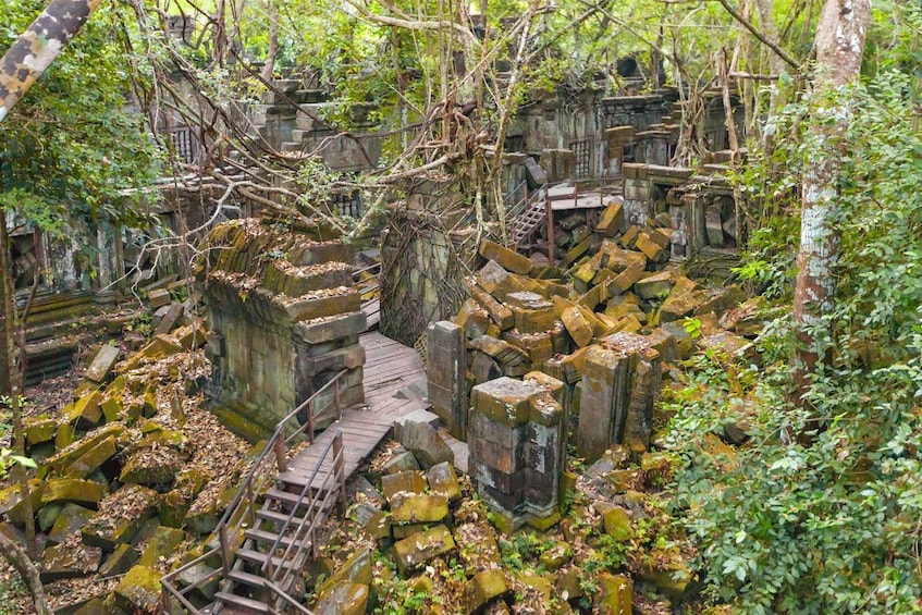 Wooden staircase built through rubble at Beng Mealea in Angkor, Cambodia