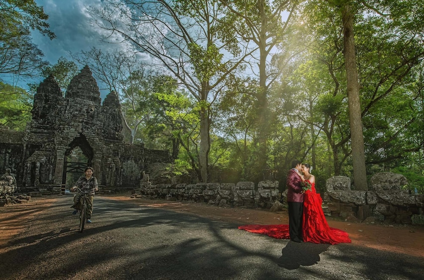 Bride and groom pose for a photo in Cambodia