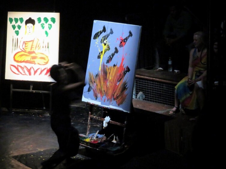 Two small paintings displayed in the light in Cambodian studio