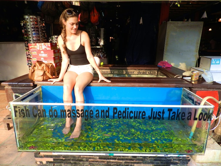 Woman receiving a Fish massage in Siem Reap
