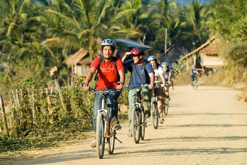Tourists bike around Rural Luang Prabang