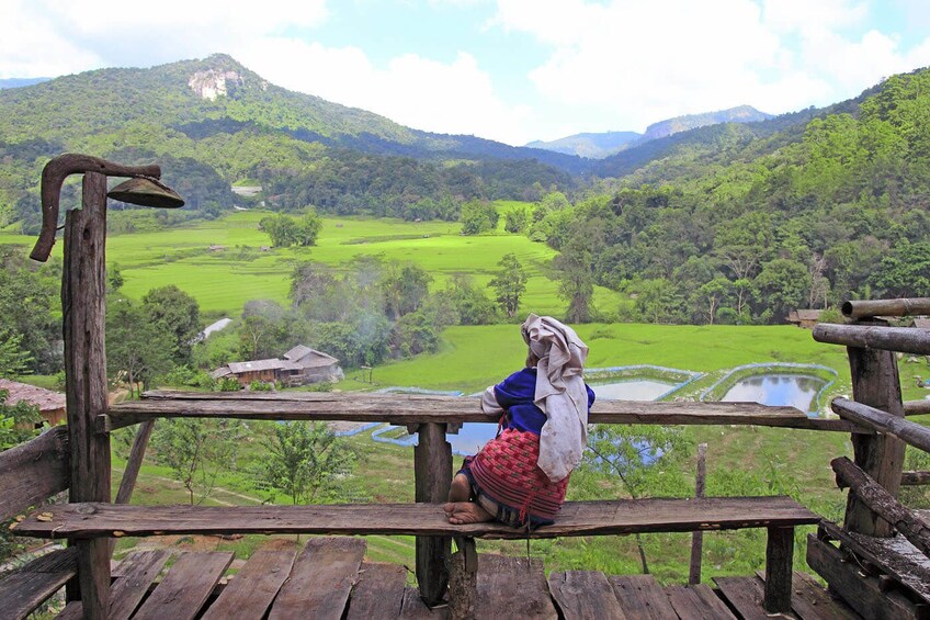 Local woman sitting on a bench in Luang Prabang