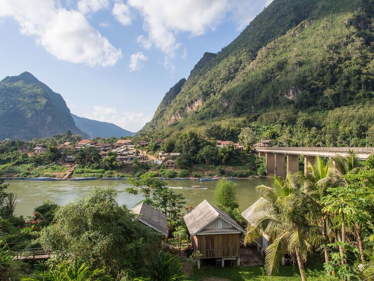 Nong Khiaw Village and surrounding mountains on a sunny day