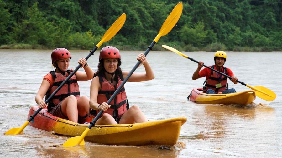 Group kayaking on the Nam Ou River