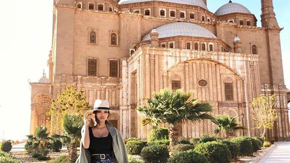 Woman poses in front of Mosque of Muhammad Ali