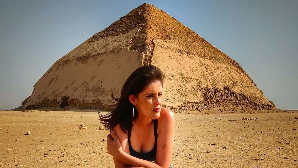 Woman poses in front Great Pyramids of Giza