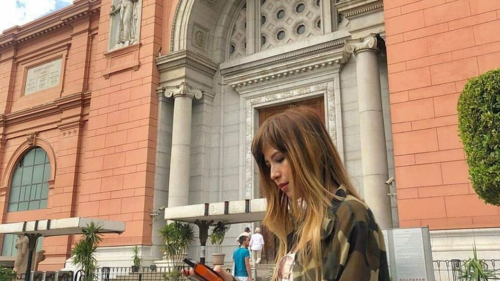 Woman in front of the Egyptian Museum in Cairo, Egypt