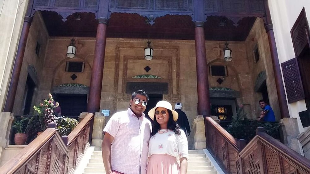 Couple poses in front of the Hanging Church