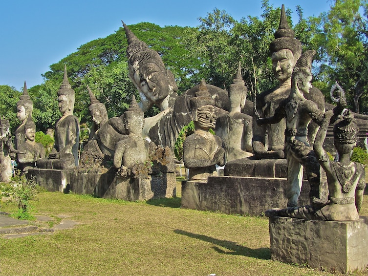 Closeup of statues at Buddha Park on a sunny day