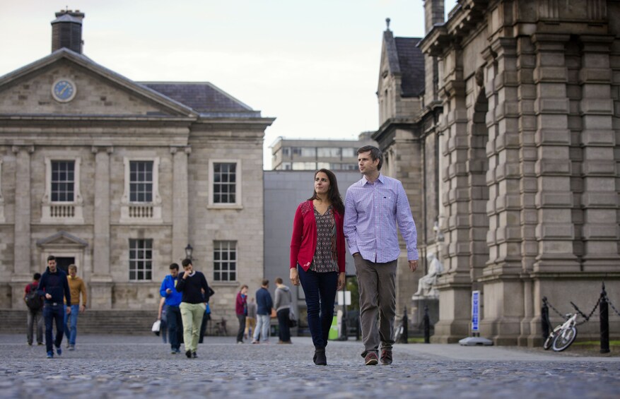 Couple walking by Trinity College Library
performing arts theater in Dublin, Republic of Ireland