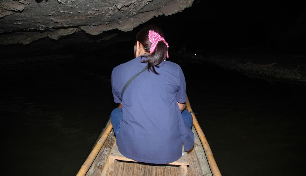 Woman on a boat in Tham Lot 