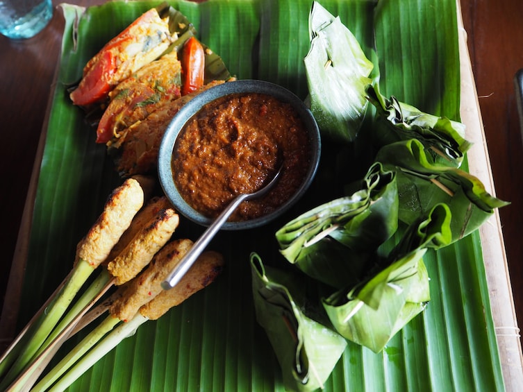Show item 1 of 4. Balinese food on a large palm leaf