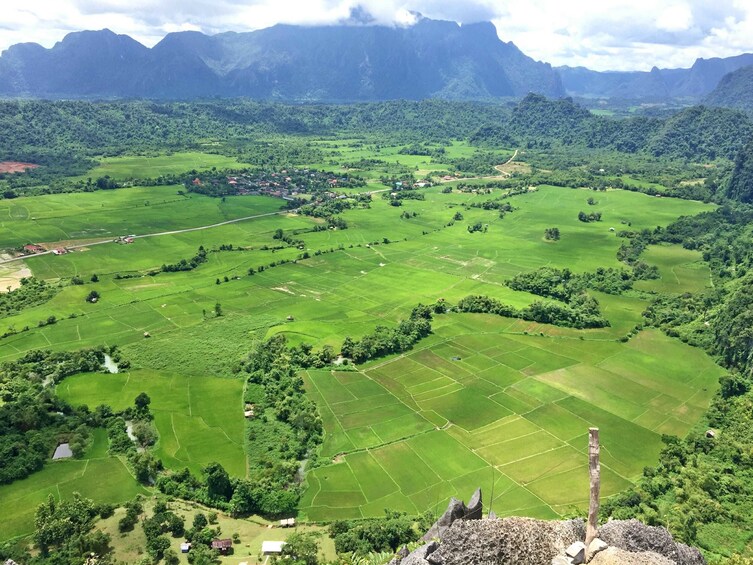 Aerial view of bright green land in Vang Vieng, Laos