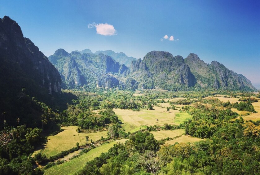 Panoramic view of Vang Vieng valley on a clear, sunny day