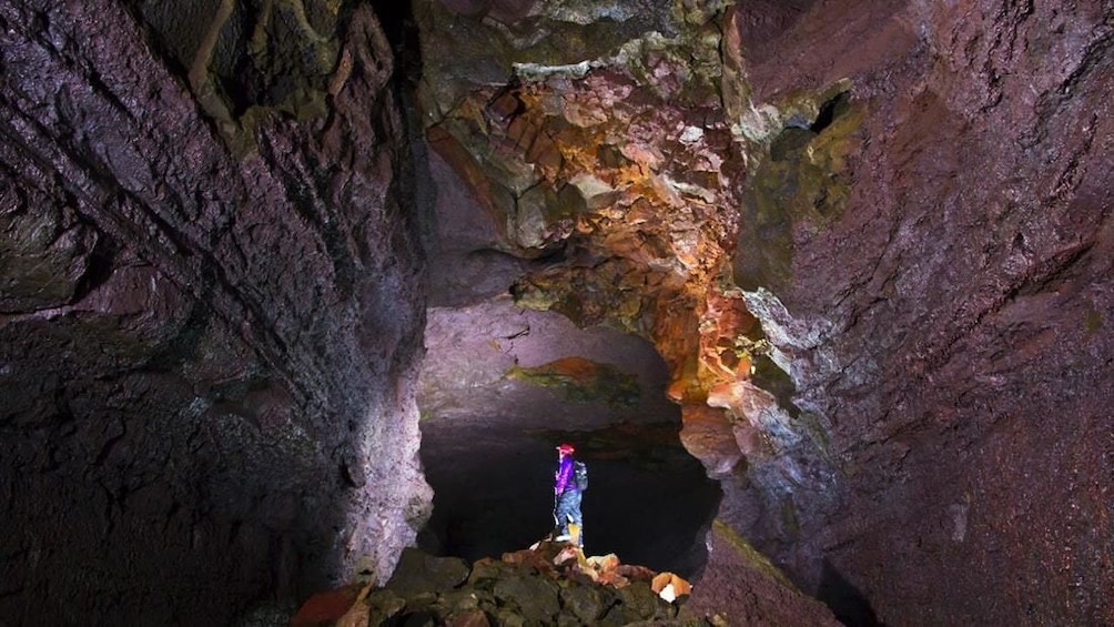 People exploring a cave in Iceland