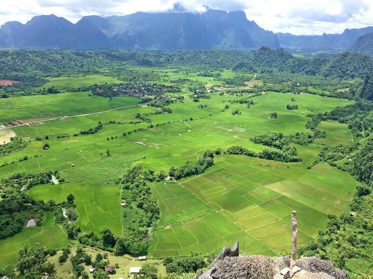 Aerial view of bright green farmland of Vang Vieng, Laos