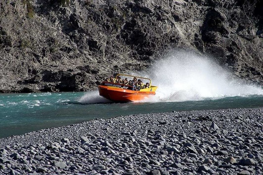 Orange jet boat on the Waimakariri River