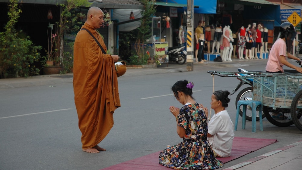 Monk offering food in Mae Hong Son