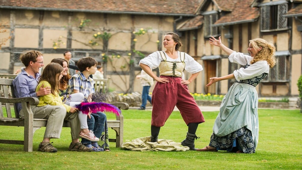 Family being entertained by live theatre at Shakespeare's Birthplace 