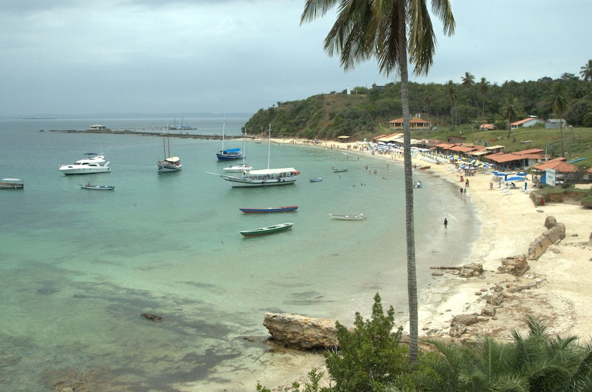 Boats approach beach on the coast of Brazil