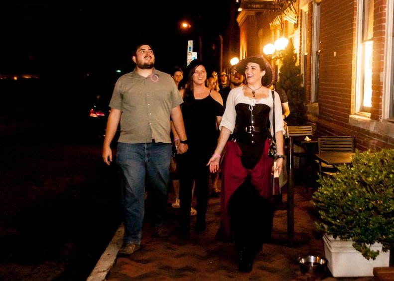 Tour guide walks with group along street in Nashville, Tennessee