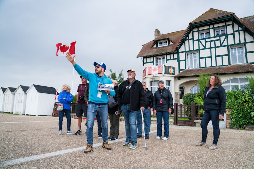 Guide and tour group at Juno Beach 