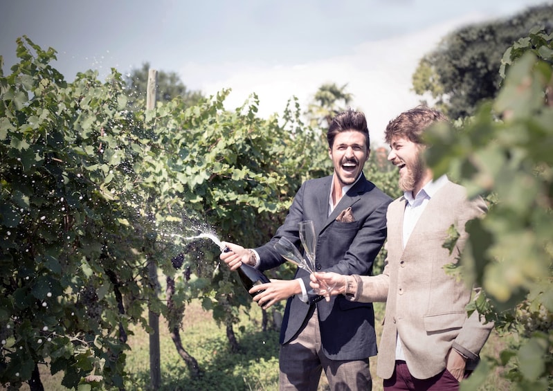 Men having some Prosecco at a vineyard in Asolo