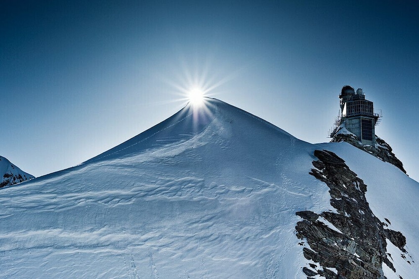 Sun at the peak of Jungfraujoch Saddle in Switzerland
