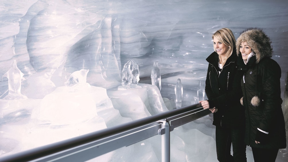 Two women stand in the Jungfraujoch Ice Palace