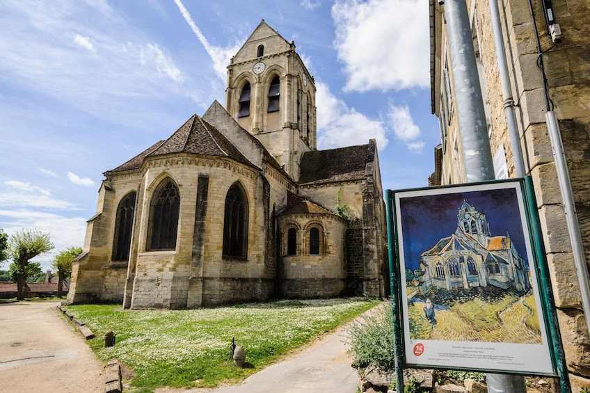 The Church at Auvers with Van Gogh's painting of it in the foreground