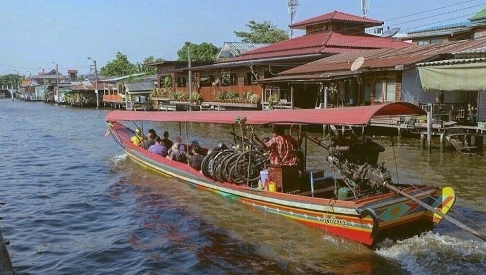 Long covered boat in Chao Phraya River in Bangkok, Thailand
