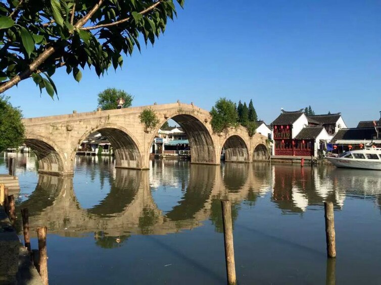 Bridge over water on sunny day in Zhujiajiao, China