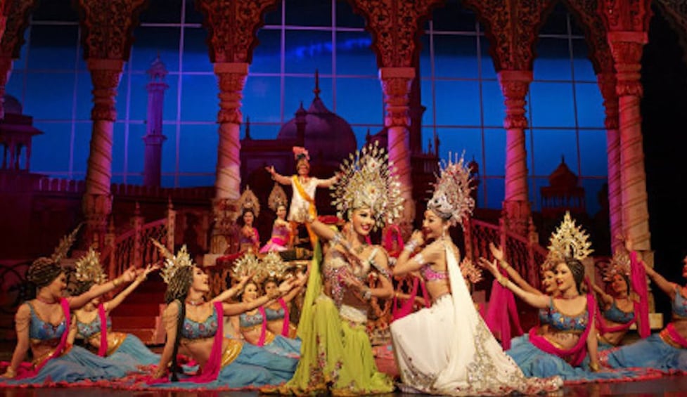 Female performers kneel in formation at Tiffany's Show Pattaya