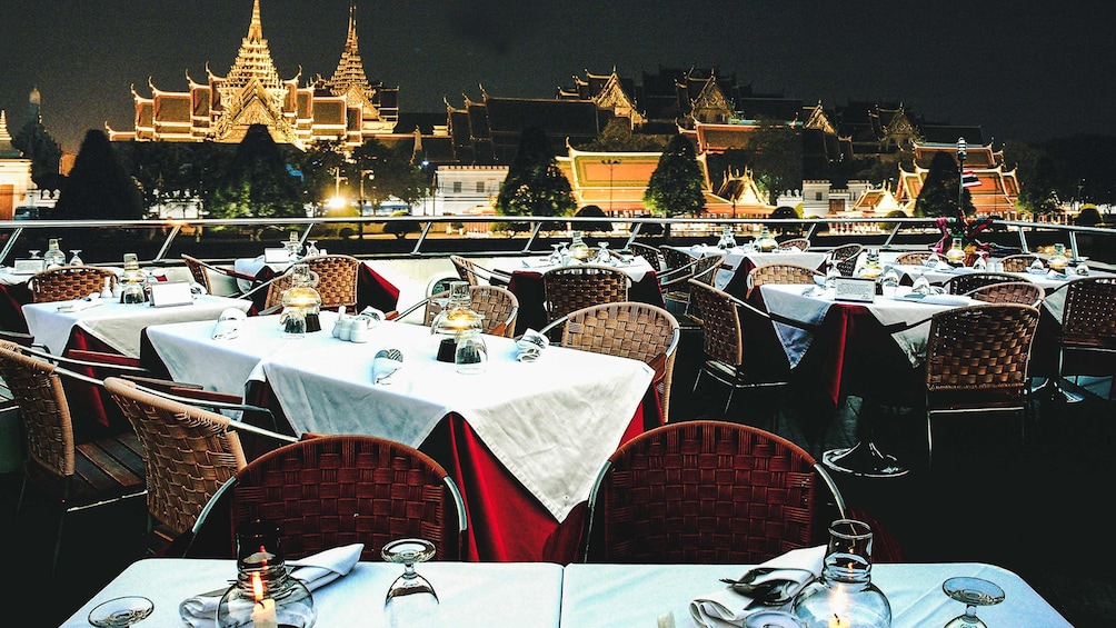 Dining tables on the deck of Grand Pearl cruise ship in Bangkok, Thailand