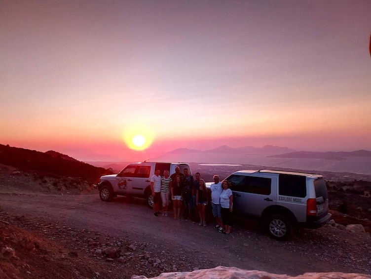 Show item 1 of 6. Two Land Rovers on path overlooking Kos sunset