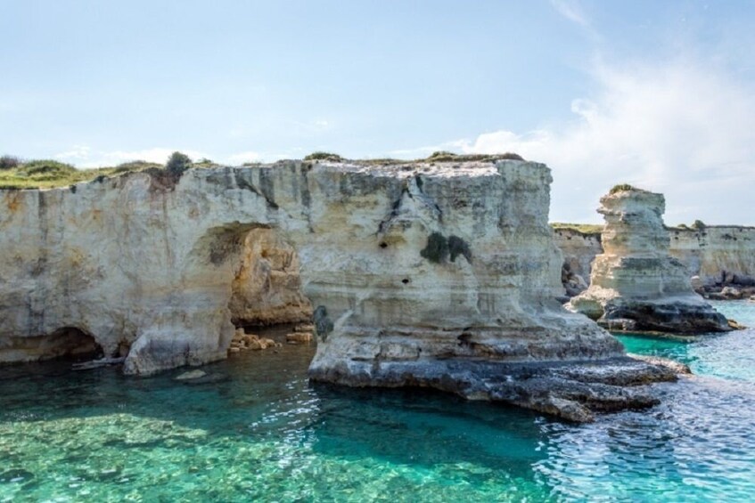 Rock stacks at Torre Sant'Andrea on a sunny day