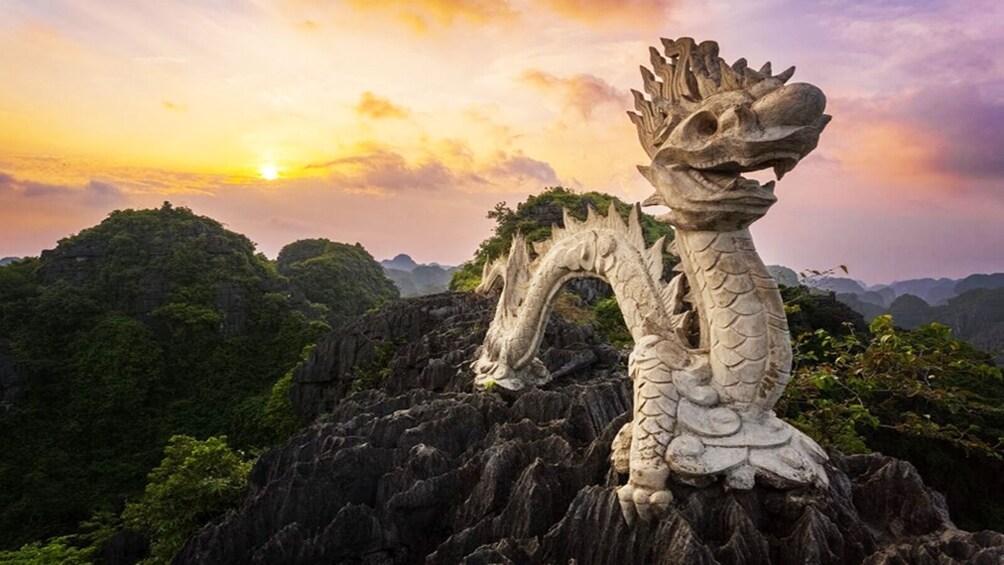 Peak of Dragon Mountain in Mua Cave area at sunset