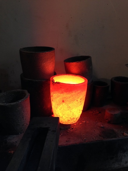 Container glowing with heat during goldsmithing process in Venice