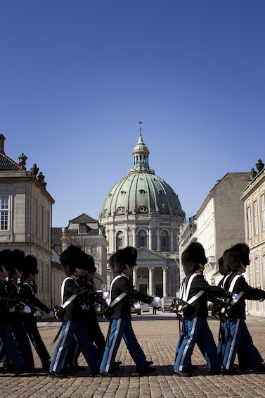 Show item 2 of 10. Guards march past Copenhagen government building